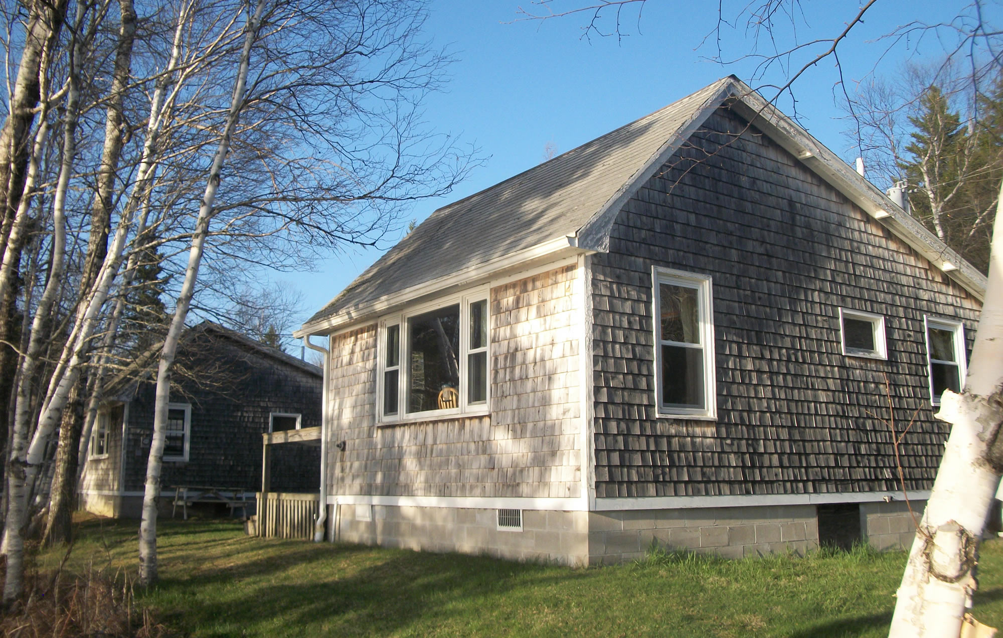 https://oceanspraycottages.com/wp-content/uploads/2025/03/Goldfinch-Cabin-home.jpg